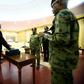 Sudanese President Omar al-Bashir (3rd-R) swears in Mohamed Tahir Ela (2nd-L) as the country's new prime minister on February 24, 2019 amid protests against the veteran president's rule and calls for him to resign