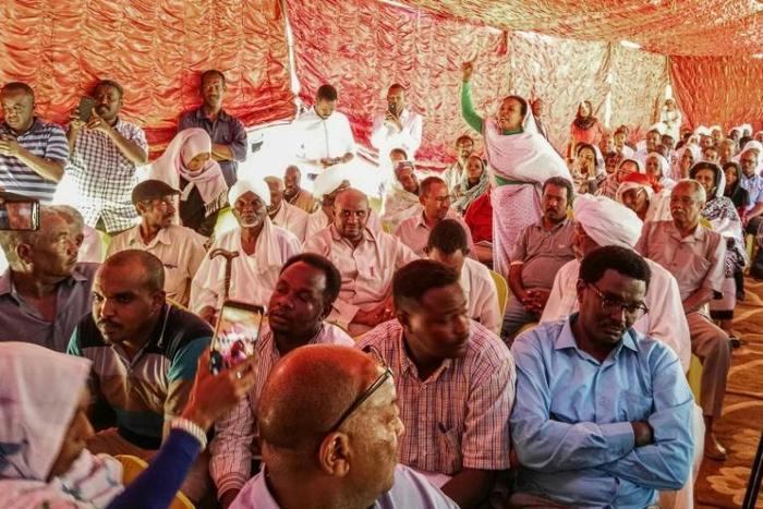 Supporters of Sudan's main opposition Umma Party attend a press conference in the capital Khartoum's twin city of Omdurman on February 13, 2019