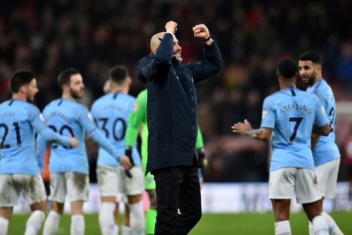 Pep pleasure: Manchester City manager applauds the travelling fans after a 1-0 win away to Bournemouth