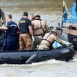 International divers and experts are assessing ways of hoisting the submerged boat or searching for bodies presumed to be stuck inside
