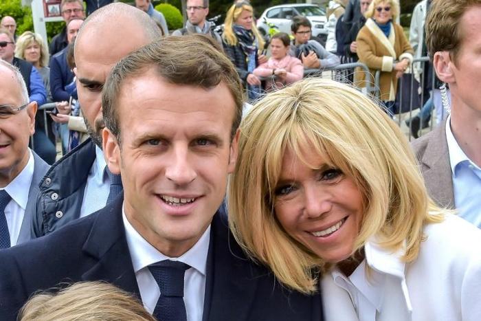 French President Emmanuel Macron, seen with his wife Brigitte, will try to form a broad centrist coalition within the EU parliament