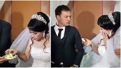 Violent groom gives his bride a heavy slap at their wedding in front of families and guests (video)