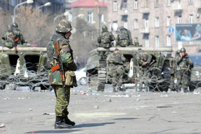 Armenian riot police are seen patrolling Yerevan in March 2008 after clashing with supporters of the defeated opposition candidate following elections