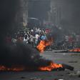 Demonstrators set tire barricades ablaze on the fourth day of protests in Port-au-Prince demanding the resignation of Haitian President Jovenel Moise