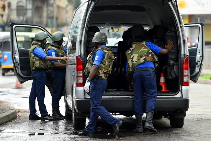 Sri Lankan soldiers inspect a van at a checkpoint in Colombo on May 3,2019, after a series of bomb blasts targeting churches and luxury hotels on Easter Sunday in Sri Lanka. Sri Lanka's Catholic Church scrapped plans to resume Sunday services following...