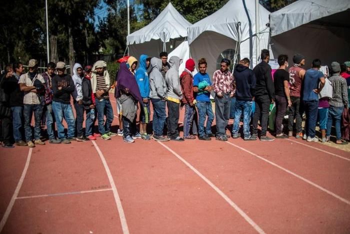 Central American migrants -- mostly Hondurans -- at a shelter in Mexico City on January 30 before heading for the US border