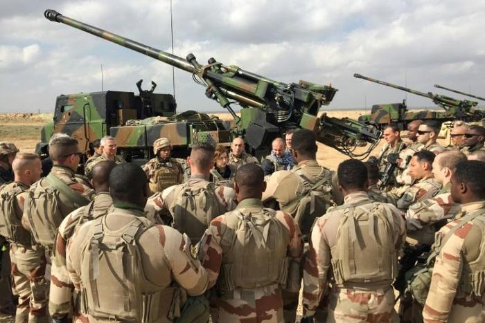 Members of the international force fighting the Islamic State group in Iraq and Syria, some of whose soldiers are pictured with French Defence Minister Florence Parly in February 2019, sees no increased threat from Iran