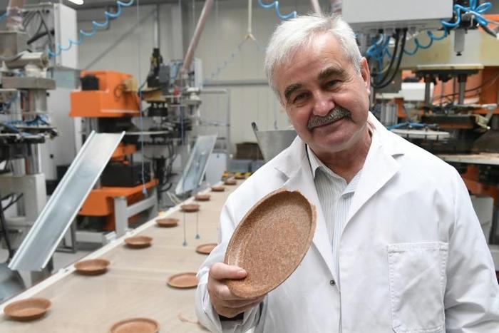 Polish inventor and entrepreneur Jerzy Wysocki holds a wheat bran plate he invented 15 years ago at the Biotrem factory in Zambrow, Poland