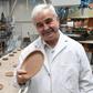 Polish inventor and entrepreneur Jerzy Wysocki holds a wheat bran plate he invented 15 years ago at the Biotrem factory in Zambrow, Poland