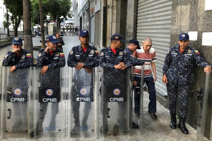 Venezuelan police block access to the legislature in Caracas as opposition lawmakers accuse the regime of 'intimidation'