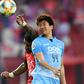 Guangzhou Evergrande's goalscorer Paulinho rises to beat Daegu's Nishi Tsubasa to a header