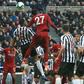 Divock Origi heads home Liverpool's winner in a 3-2 victory at Newcastle