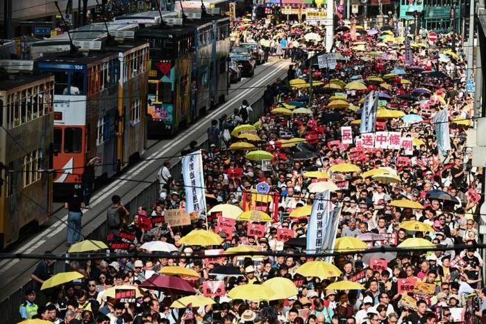 The demonstration comes just days after four prominent leaders of Hong Kong's democracy movement were jailed for their role in organising mass pro-democracy protests in 2014