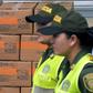 Colombian policewomen walk past boxes with US humanitarian aid goods in Cucuta, Colombia, on the border with Tachira, Venezuela, on February 8, 2019