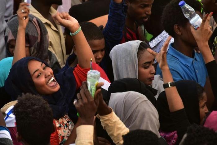 Protesters celebrate concessions made by Sudan's new military council on Saturday