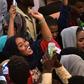 Protesters celebrate concessions made by Sudan's new military council on Saturday