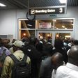 Passengers at the Nnamdi Azikwe International Airport, who were scheduled to travel to Ibadan by Arik Air but were left stranded for hours, block boarding gate at Abuja Airport January 30, 2015, in protest.