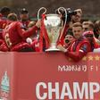 Liverpool captain Jordan Henderson kept a tight grip on the Champions League trophy