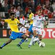 Midfield stars Themba Zwane (L) of Mamelodi Sundowns and Brahim Nakach of Wydad Casablanca seek possession during the first leg of a CAF Champions League semi-final won 2-1 by the Moroccans in Rabat