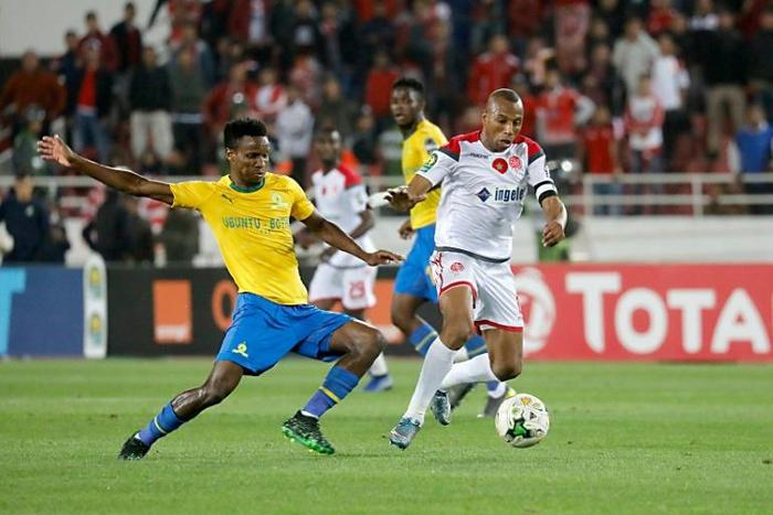 Midfield stars Themba Zwane (L) of Mamelodi Sundowns and Brahim Nakach of Wydad Casablanca seek possession during the first leg of a CAF Champions League semi-final won 2-1 by the Moroccans in Rabat