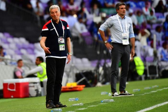Etoile Sahel coach Roger Lemerre (L) watches his side playing in the Arab Club Champions Cup final against Al Hilal of Saudi Arabia, which they won.