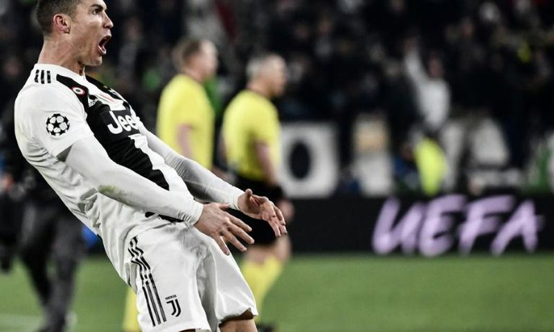 Juventus' Portuguese forward Cristiano Ronaldo celebrates after scoring a hat-trick against Atletico Madrid.