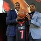 Toronto Raptors president Masai Ujiri, at left alongside Raptors star Kyle Lowry, went from a boyhood in Nigeria to making decisions that could bring the NBA title to Toronto