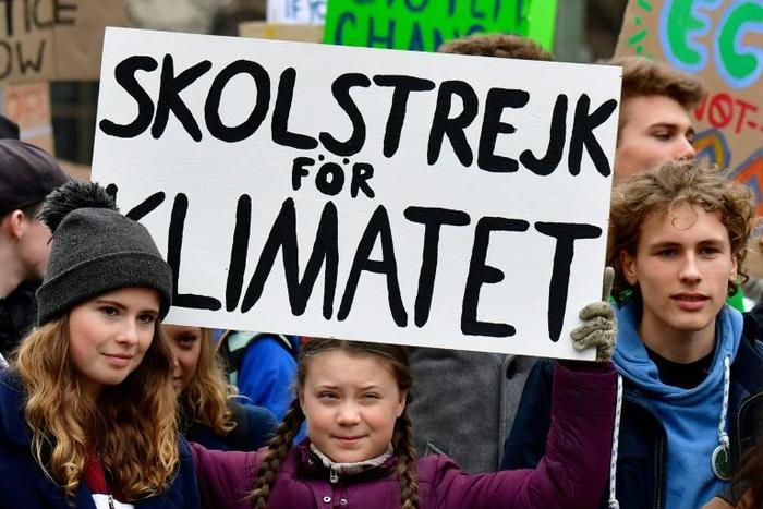 German activists Luisa Marie Neubauer (L), Jakob Blasel (R) and Swedish activist Greta Thunberg have pushed climate change issues to the fore