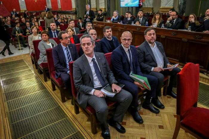 Former Catalan separatist leaders including (from front row L-R) Joaquim Forn, Raul Romeva, Oriol Junqueras, Josep Rull, Jordi Turull and Jordi Sanchez attend their trial at the Supreme Court in Madrid on February 12, 2019