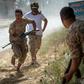 Fighters loyal to Libya's internationally recognised unity government run for cover during recent clashes with the self-styled Libyan National Army