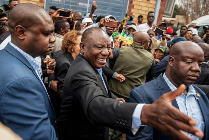 South African President Cyril Ramaphosa greeted voters before casting his ballot at a primary school in Soweto