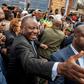 South African President Cyril Ramaphosa greeted voters before casting his ballot at a primary school in Soweto