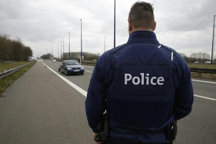 A three-day wave of raids netted more than 8,200 cannabis plants, along with 200 grams of cocaine, luxury cars and nearly 90,000 euros in cash, with most of the arrests taking place in Belgium (police officer pictured March 2016)