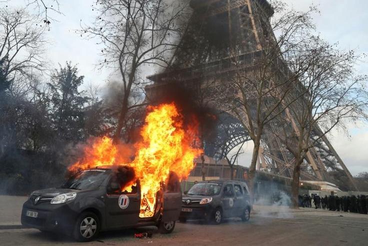 A car belonging to the French anti-terrorism unit Sentinelle was one several cars torched along the route of the 'yellow vests' march