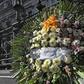 A floral wreath outside Buenos Aires' Congress building where lawmaker Hector Olivares was fatally wounded in a shooting last week that left his friend Marcelo Yadon dead at the scene