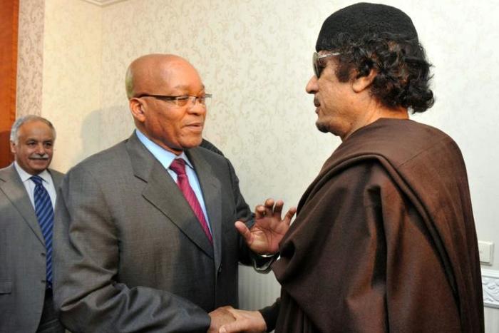 Zuma, left, pictured with Kadhafi on May 30 2011, when he made a one-day visit to Tripoli as head of an African Union delegation mediating in the Libyan crisis. Zuma has denied a newspaper report that he was given $30 million by Kadhafi for 'safe keepi...