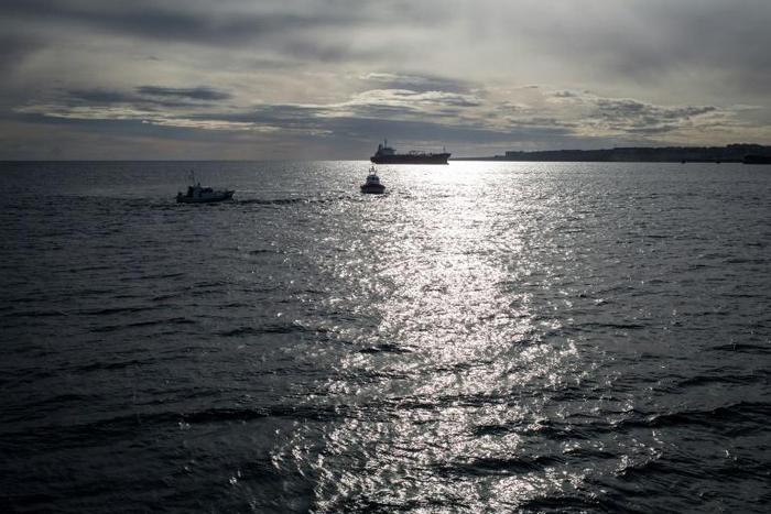 Vessel from the Italian Coast Guards and Guardia di Finanza (Italian border police) patrol around the Dutch-flagged Sea Watch 3 NGO vessel, in January 2019