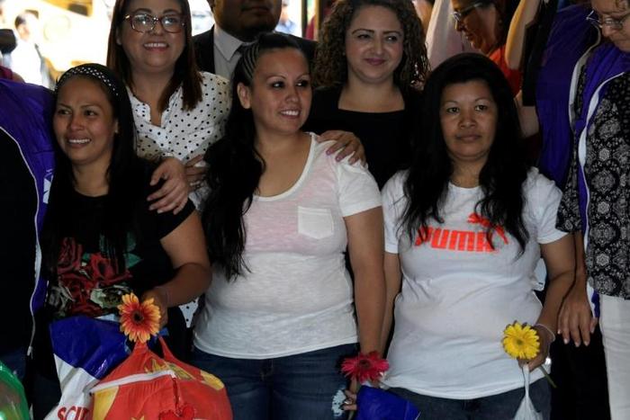 Alba Lorena Rodriguez (L) and Cinthia Marcela Rodriguez are pictured shortly after being released from the Women's Rehabilitation centre in Ilopango, El Salvador, on March 7, 2019