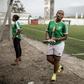 Two members of the FC Mamans national football team, Armelle Sylva and Hairiat Abdourahmane, get ready for their training session