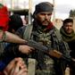 Fighters with the US-backed Syrian Democratic Forces (SDF) in the frontline village of Baghouz where they are fighting against the last shred of the Islamic State (IS) group's "caliphate"