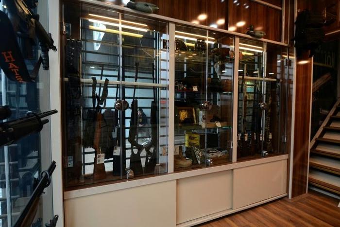 Rifles and other items are displayed in a gunshop in the northern Iraqi city of Mosul