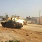 Image from a video published on the Libyan strongman Khalifa Haftar's self-proclaimed Libyan National Army War Information Division's Facebook page on April 16, 2019, shows a tank firing its turret reportedly in a southern suburb of the capital Tripoli...