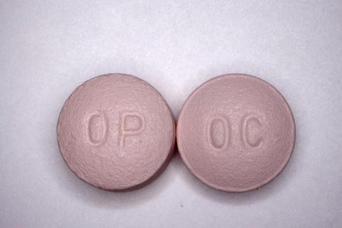This undated handout file photo obtained courtesy of the US Drug Enforcement Administration shows 20 mg pills of the opioid painkiller OxyContin