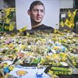Yellow flowers are displayed in front of a portrait of Argentinian forward Emiliano Sala at the Beaujoire stadium in Nantes, France -- Sala was traveling from Nantes to his new club Cardiff City when he died