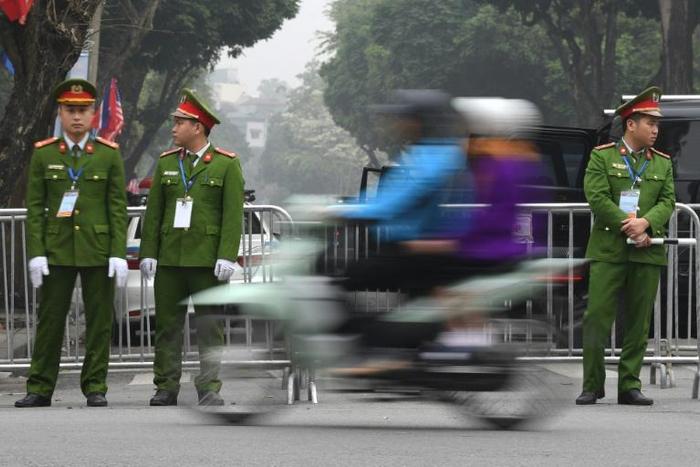 On guard: Vietnam police on duty in Hanoi