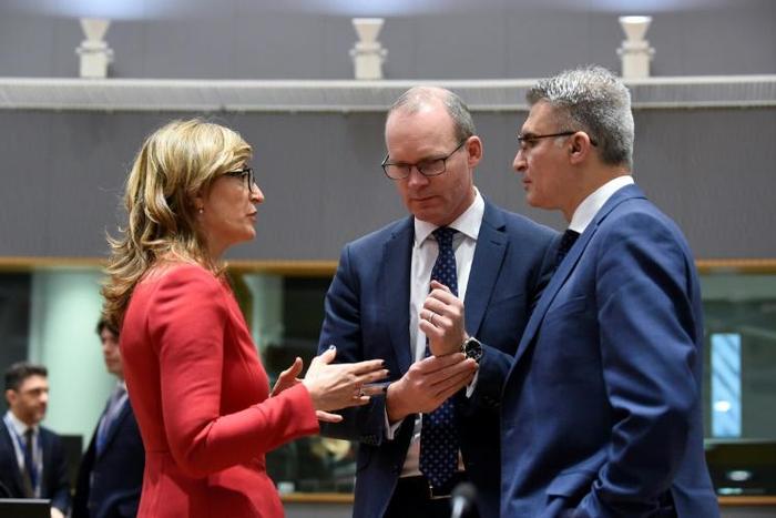 Irish Foreign Minister Simon Coveney (C) talks with Bulgarian Foreign Minister Ekaterina Zaharieva (L) and Malta Foreign Minister Carmelo Abela (R) during a Foreign Affairs Council at the EU headquarters in Brussels on February 18, 2019