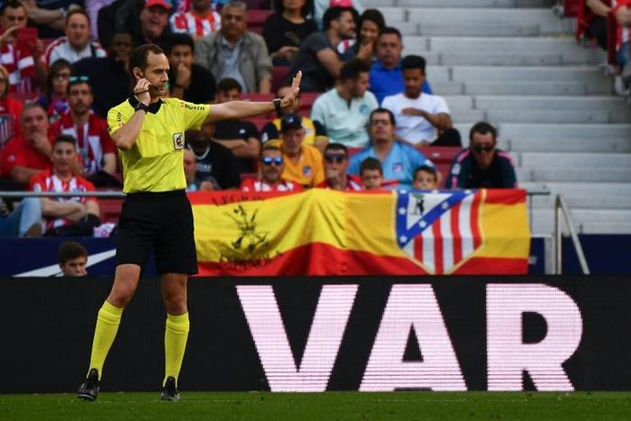 Atletico Madrid had to survive a VAR penalty review to beat Real Valladolid and delay Barcelona's La Liga title party