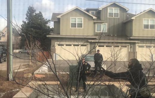 White officer placed on leave after detaining black man picking up trash in front of his building