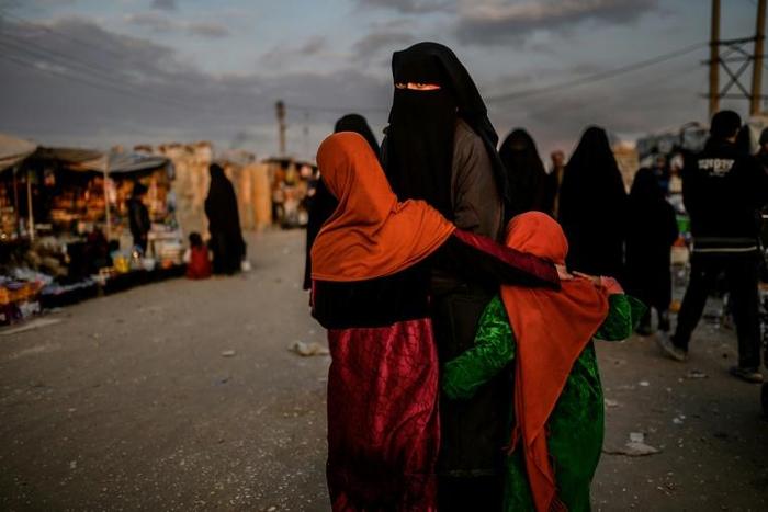 A veiled woman looks back at Al-Hol camp in northeastern Syria in this file picture taken on February 17, 2019