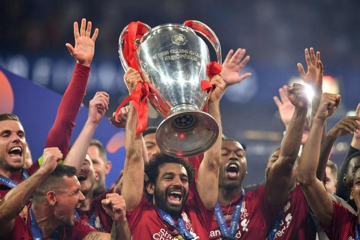 Mohamed Salah lifts the Champions League trophy after Liverpool were crowned kings of Europe for a sixth time